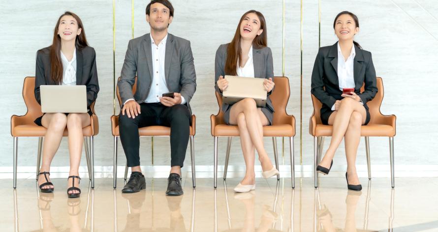 Shot portrait of a diverse asian group of businesspeople looking to side view while they wait in line for interview